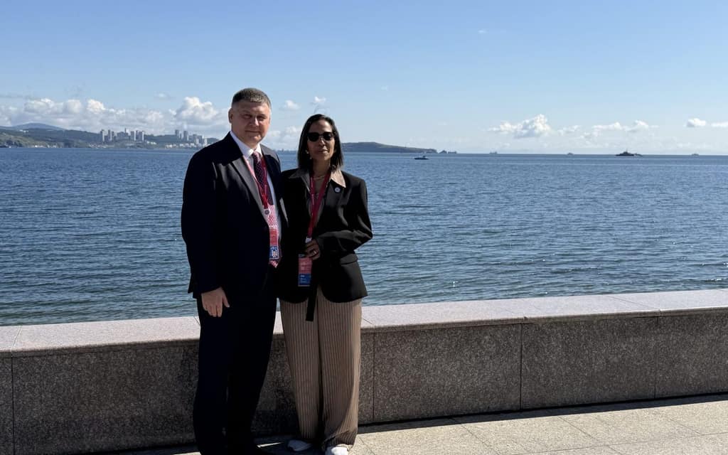 Two delegates on a waterfront during the mission to the Russian Federation